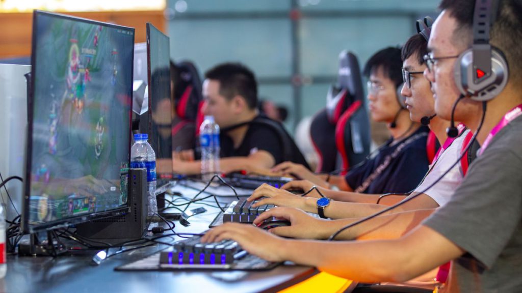 China players playing video games. China has not approved a single game title since July 2021.