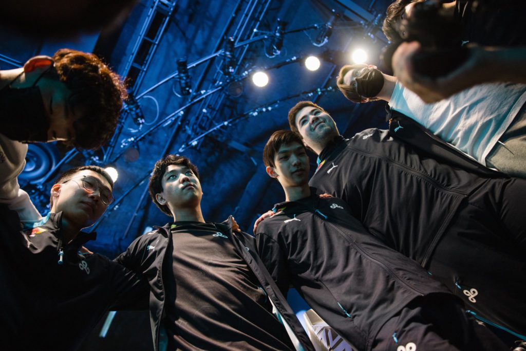The Cloud9 League of Legends team in a team hug during LCS Week 4. You can see players like Fudge, Summit and more in this image.