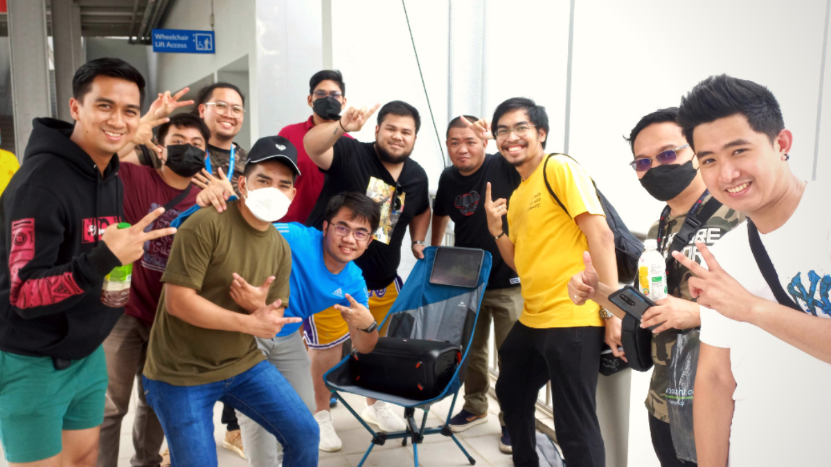 Fans without tickets set up their own mini watch party outside the TI11 stadium