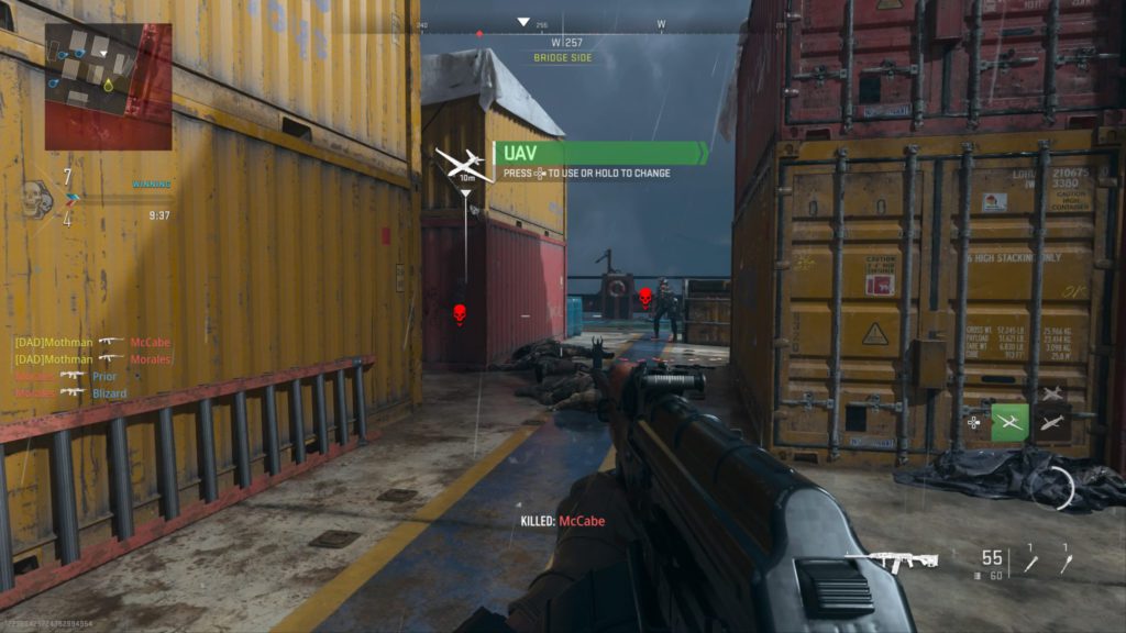 The Operator looks at two enemies he killed and one alive that is ready to fire upon him in MW2.