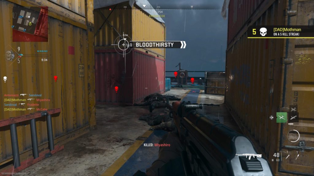 The Operator stands over multiple enemies he has killed on the Shipment map of MW2.