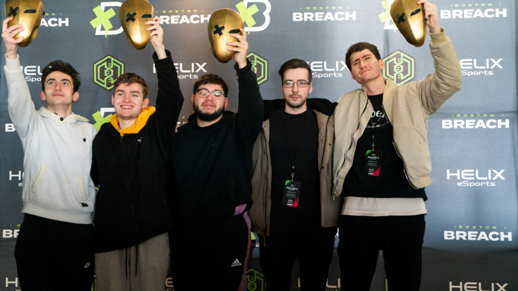 The Decimate Gaming roster holding up their Breach Mask trophies at the end of the event in Boston.