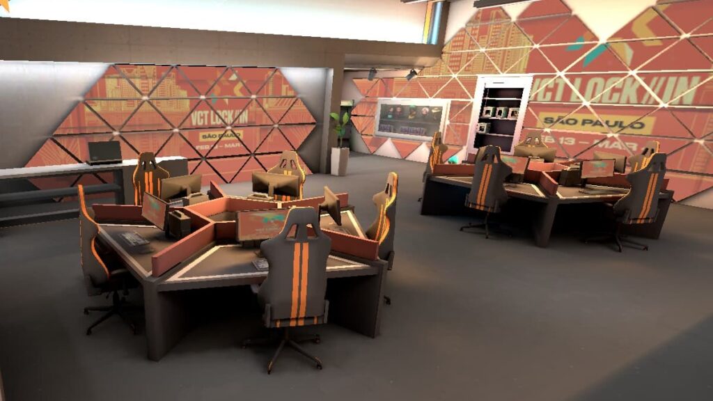 The gaming lounge next to the Defender Spawn on Split in VALORANT is decorated for VCT LOCK//IN.