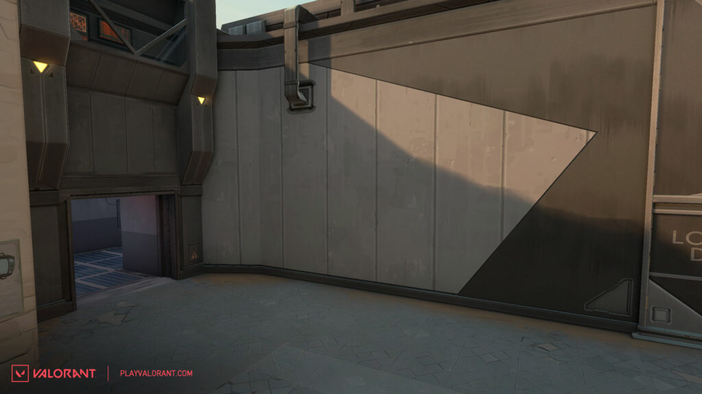 The view of VALORANT map Bind's A Site back wall near Defender spawn after receiving changes.