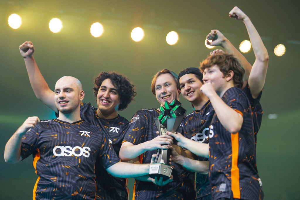 The Fnatic VALORANT roster holding the VCT LOCK//IN Trophy after winning the first VALORANT event of 2023.