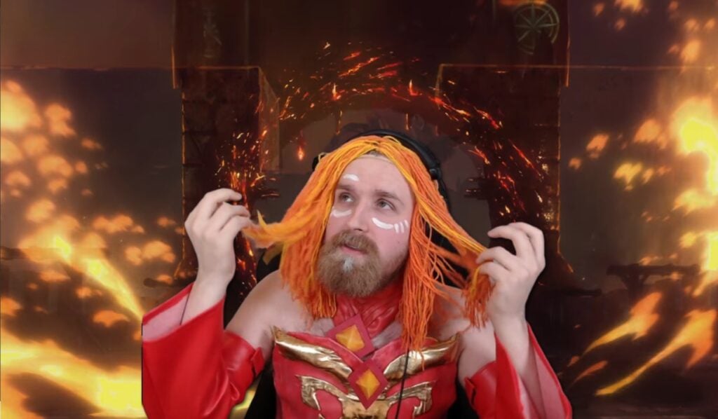 TeaGuv, cosplaying as Lina, is writing down every hero’s stats before Dota 2 Patch 7.33