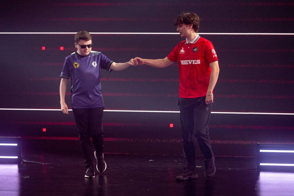 Brendan "BcJ" Jensen of Evil Geniuses (L) and Peter "Asuna" Mazuryk of 100 Thieves fist bump as they makes an entrance onstage during Week 2 of 2023 VCT Americas at the Riot Games Arena on April 10, 2023.