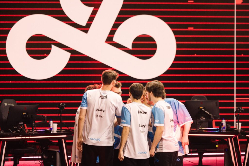 Cloud9 and mCe huddle onstage before competing during Week 4 of 2023 VCT Americas at the Riot Games Arena on April 23, 2023.