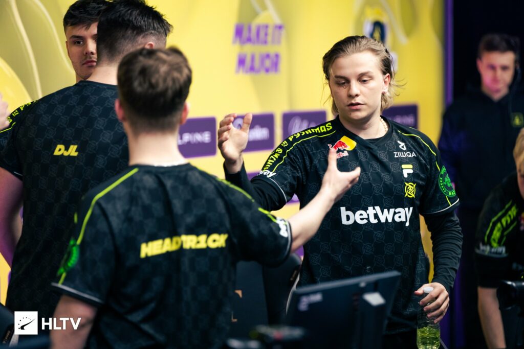 NIP players shaking hands after the match. You can see AleksiB who is looking for a teammates' hand. 