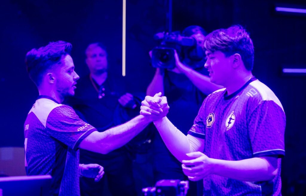Ethan "Ethan" Arnold (L) and Corbin "C0M" Lee of Evil Geniuses shake hands onstage while competing during Week 9 of 2023 VCT Americas Playoffs at the Riot Games Arena on May 23, 2023.