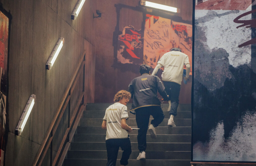 GG between matches walking backstage - image via Colin Young-Wolff/Riot Games