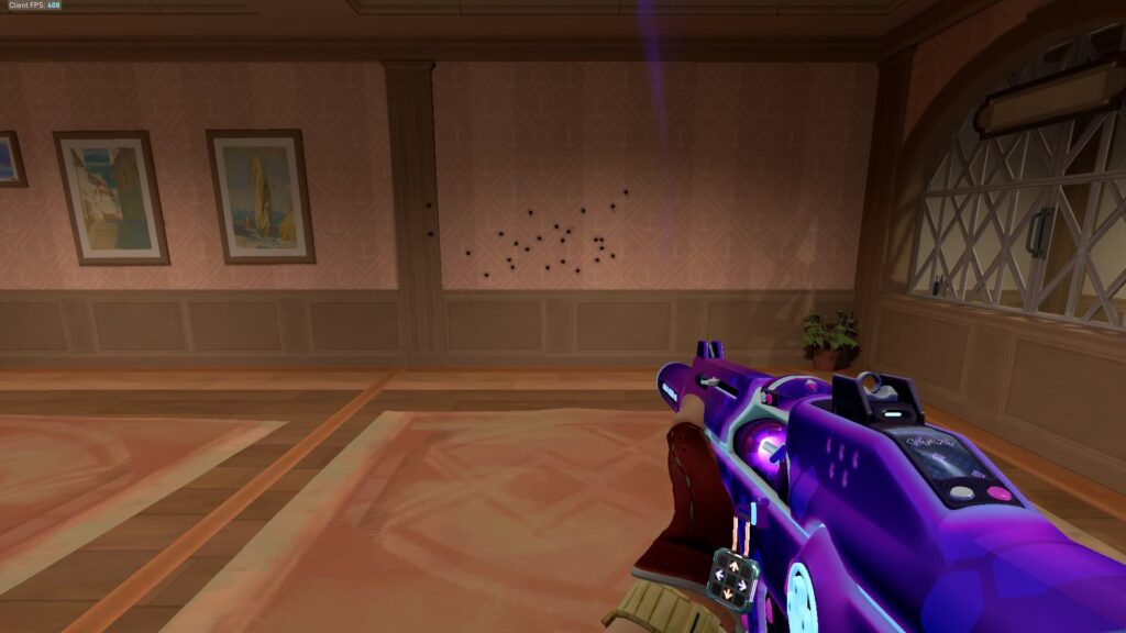 Chamber fires his Phantom and looks at the bullet holes in the wall, showing the running spray pattern.
