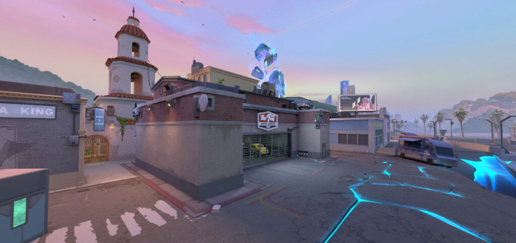 One Spawn location on Sunset, the new VALORANT map, is near the Kingdom sinkhole disaster. It has multiple cars and trucks near it, along with an auto body repair shop.
