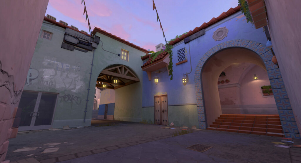 Two archways show the differing styles in architecture on the new VALORANT map, Sunset.