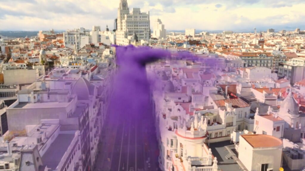 Purple smoke snaking through Madrid city - advertisement for VALORANT Masters Madrid