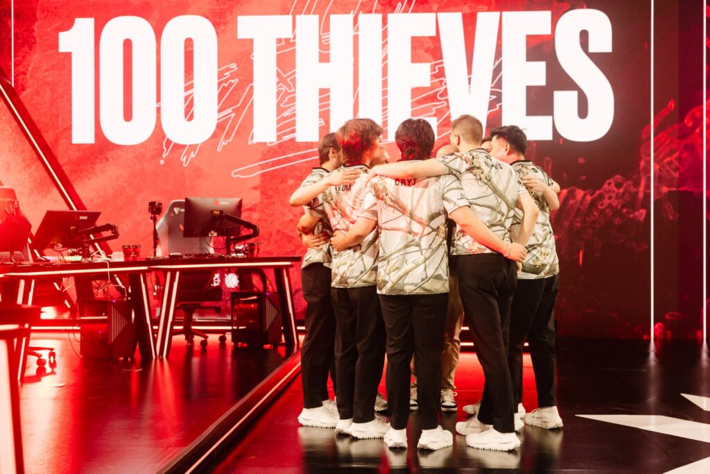100 Thieves huddles onstage during 2023 VCT Americas Last Chance Qualifier at the Riot Games Arena on July 16, 2023.