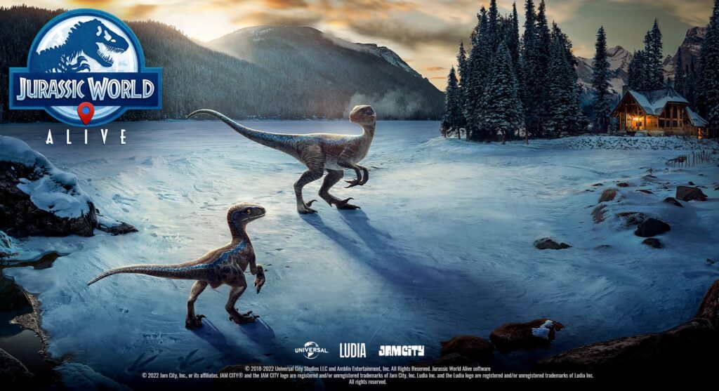 Two raptors stand near each other in the snow, yards away from a cabin, in Jurassic World alive.