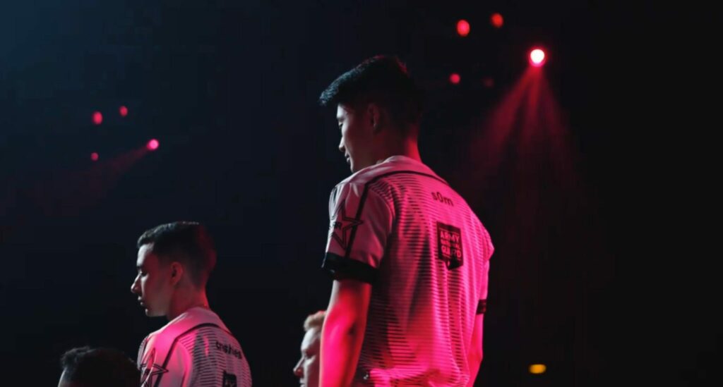 S0m facing away from the camera on stage