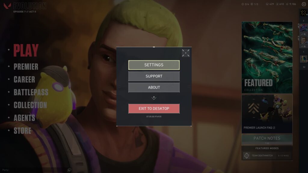 The submenu in VALORANT shows the Settings option at the very top of the box that appears.
