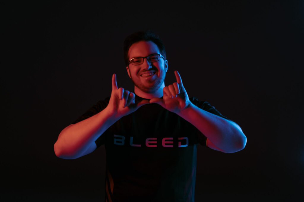 An image of Yay posing for the camera wearing the Bleed esports jersey.
