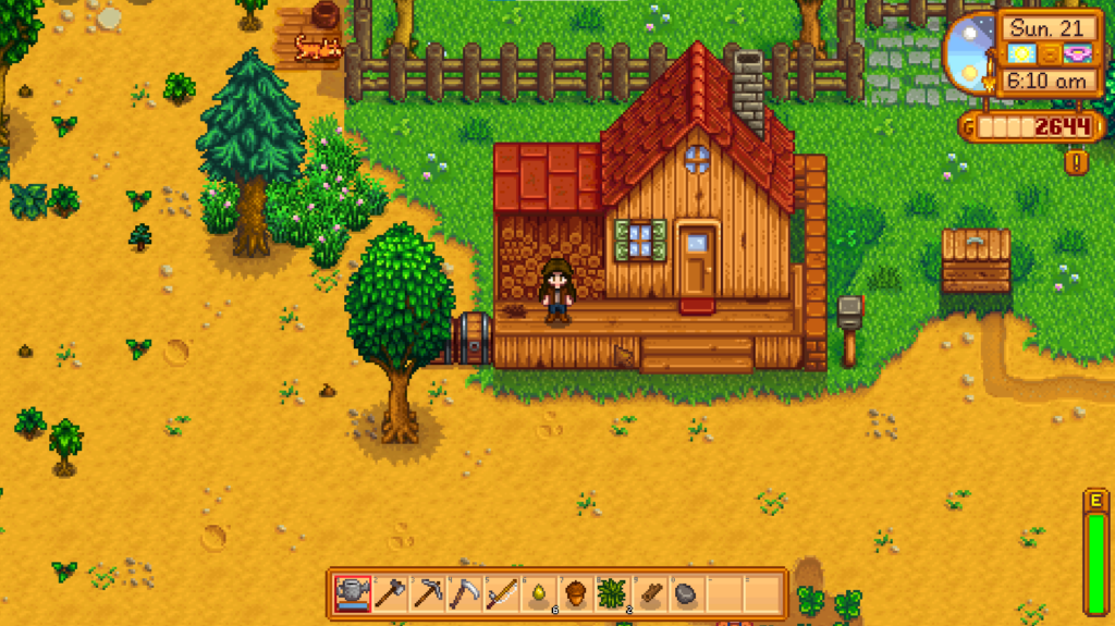 Screenshot of a new game of Stardew Valley with character standing on their porch.