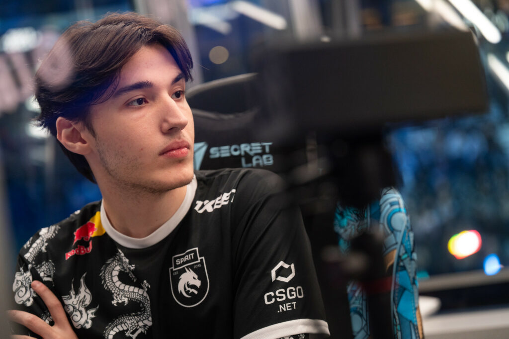 Collapse sits at his PC playing Dota at DreamLeague during a DDOS attack.