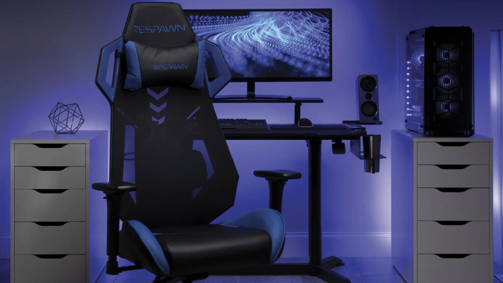 The Respawn 200 gaming chair sits in front of a computer desk.