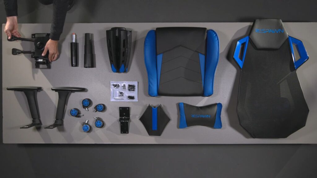 The Respawn 200 Gaming Chair parts are laid out on a table.