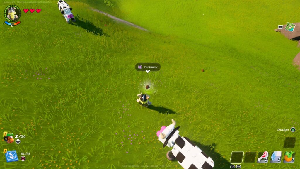 Magnus looks to collect fertilizer in LEGO Fortnite with the square button.