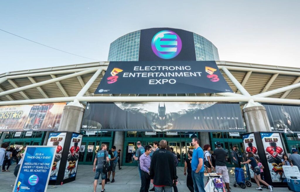 The front of E3, with a Rockstar Energy banner and a banner for a Batman game.
