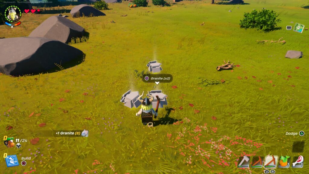 Magnus stands before three piles of granite to collect in LEGO Fortnite.