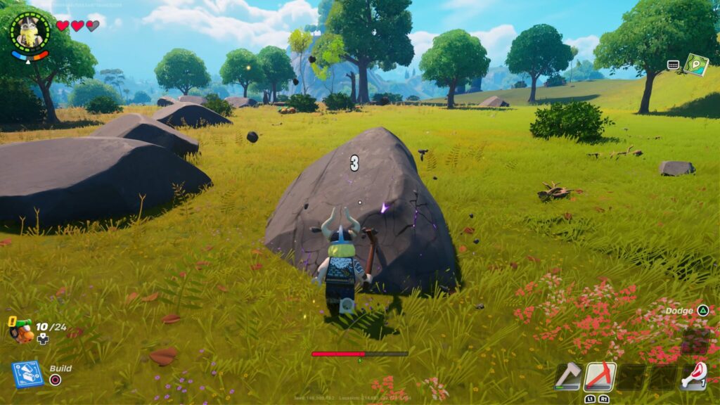 Magnus swings his pickaxe at a large rock in LEGO Fortnite.