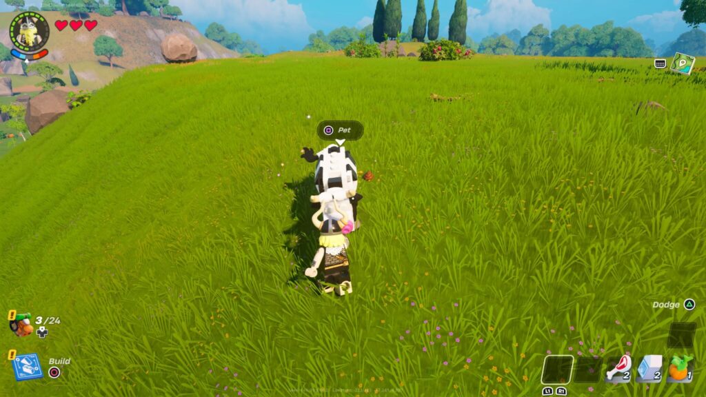 Magnus pets a cow in LEGO Fortnite.