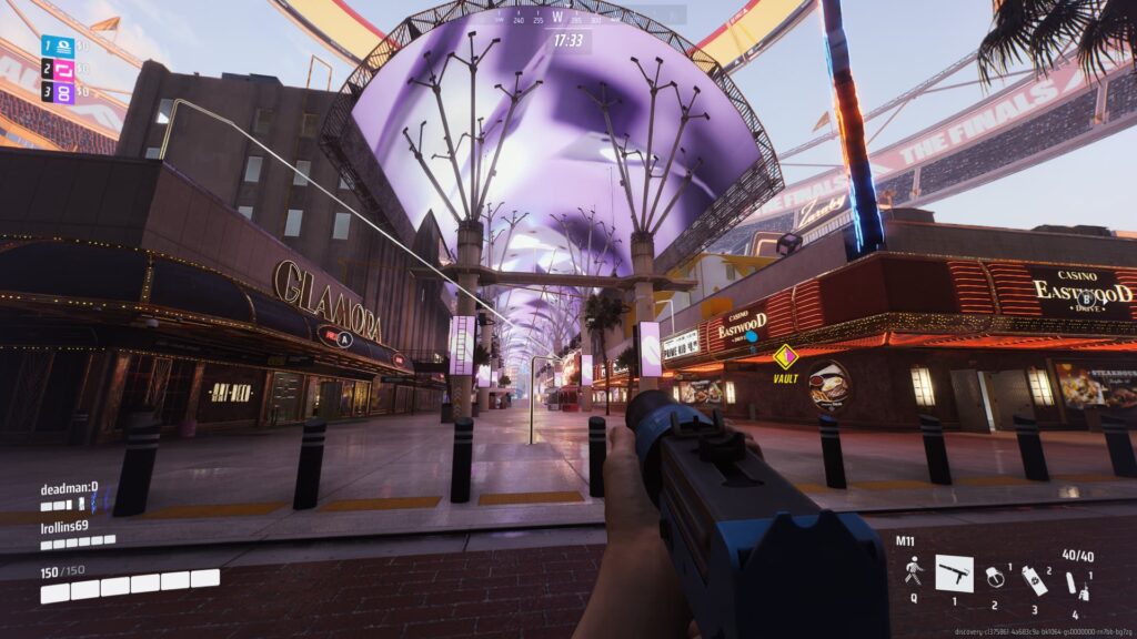A player looks towards the overhanging screen near a casino on the Las Vegas map of The Finals.