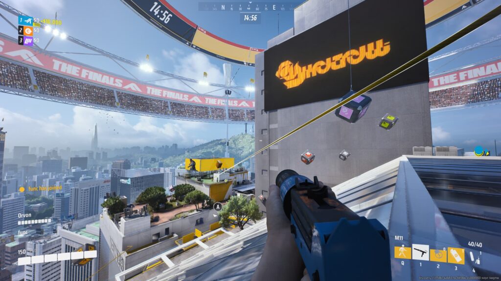 A player stands atop one of the many high rises on the Seoul map of The Finals.