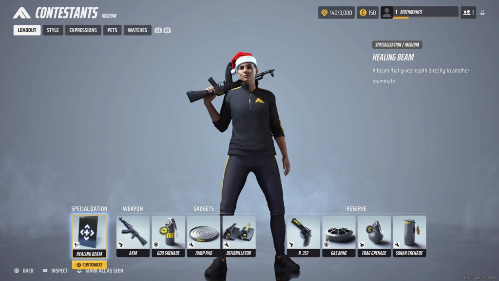 A contestant in The Finals stands with a tracksuit, a weapon, and a Santa hat on her head.