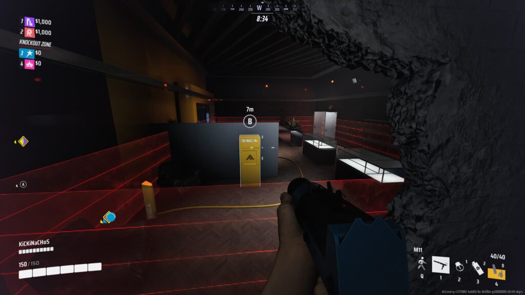 A player looks upon a cashout surrounded by laser tripwires.