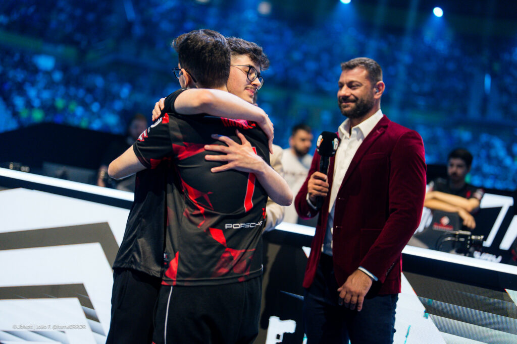 The twins hugging after one becomes a Six Invitational Winner.