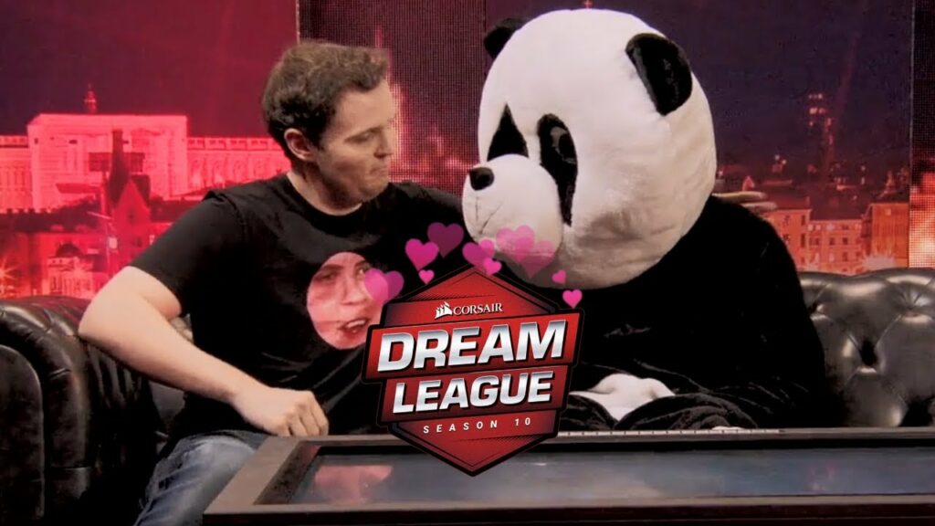AdmiralBulldog in the DreamLeague S10 panel, facing a man in a panda costume.
