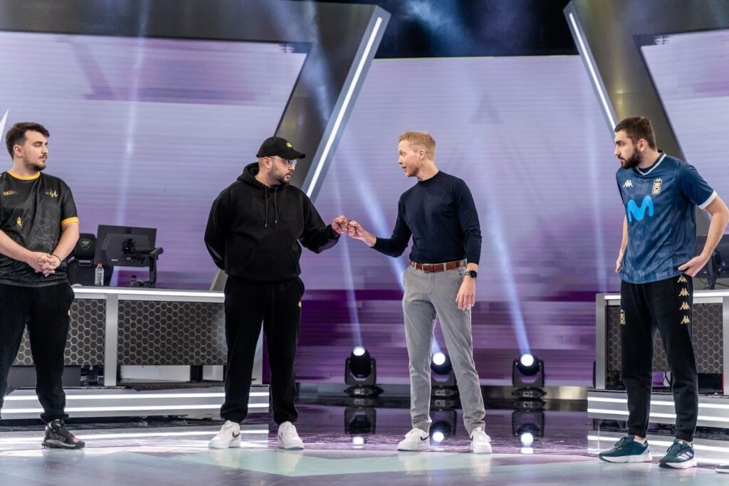 BBL coach Epic fist bumps the KOI coach.