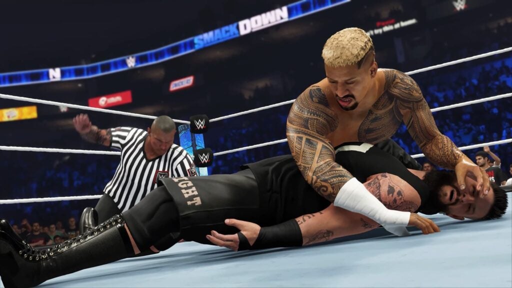 Randy Orton counts a pin as the special guest referee while Solo Sikoa covers Kevin Owens in WWE 2K24.