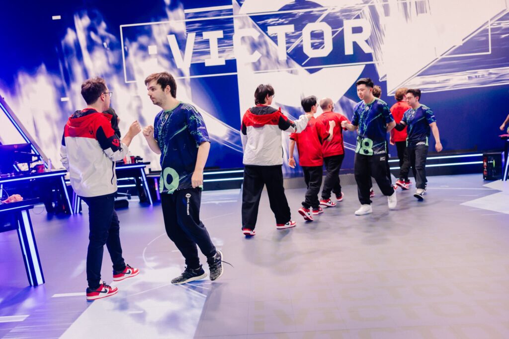 Sentinels and Evil Geniuses fist bump on stage during Week 3 of VCT Americas Stage 1 at the Riot Games Arena on April 23, 2024. 