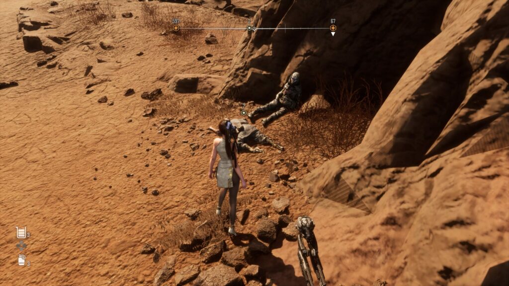 EVE comes across two bodies in the Wasteland.