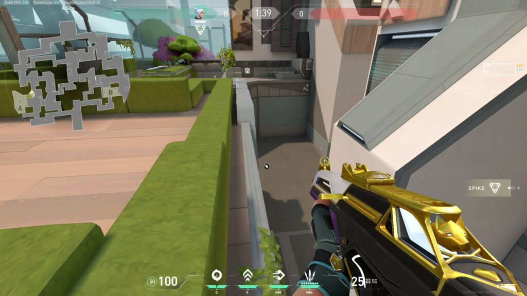 Jett sits on a ledge near A Site on Split in VALORANT.