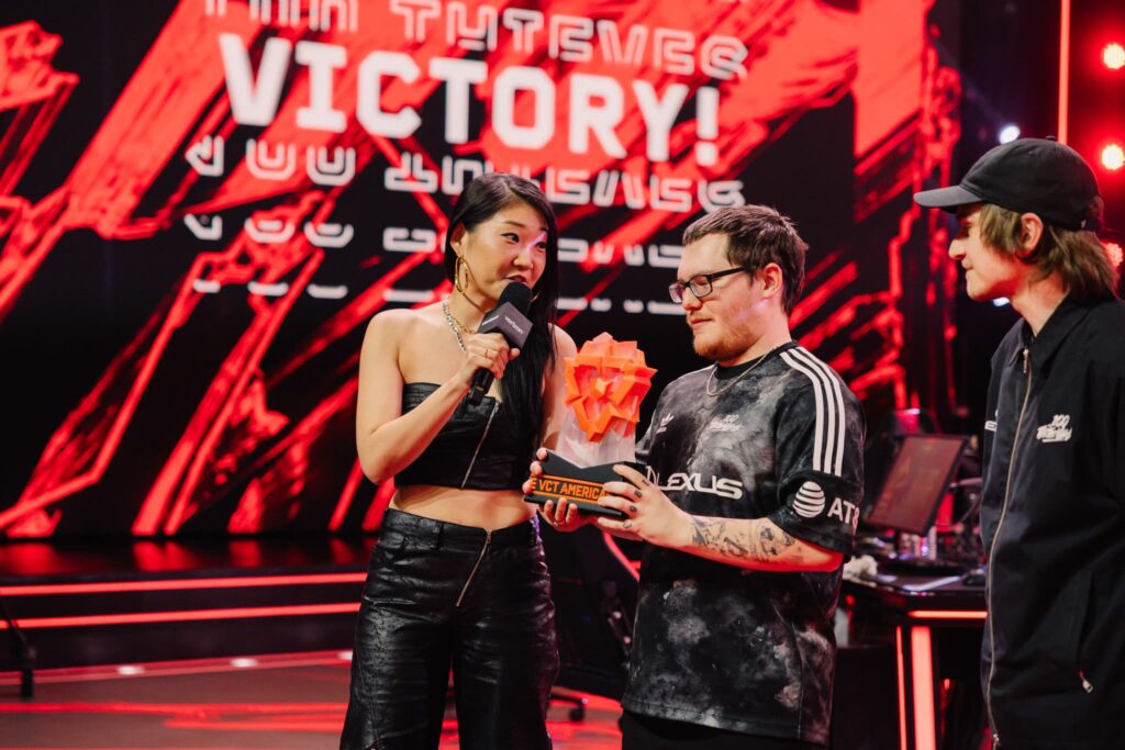 Esports host “Smix” (L) interviews Boostio of 100 Thieves onstage after victory during VCT Americas Mid-Season Finals at the Riot Games Arena on May 12, 2024. 