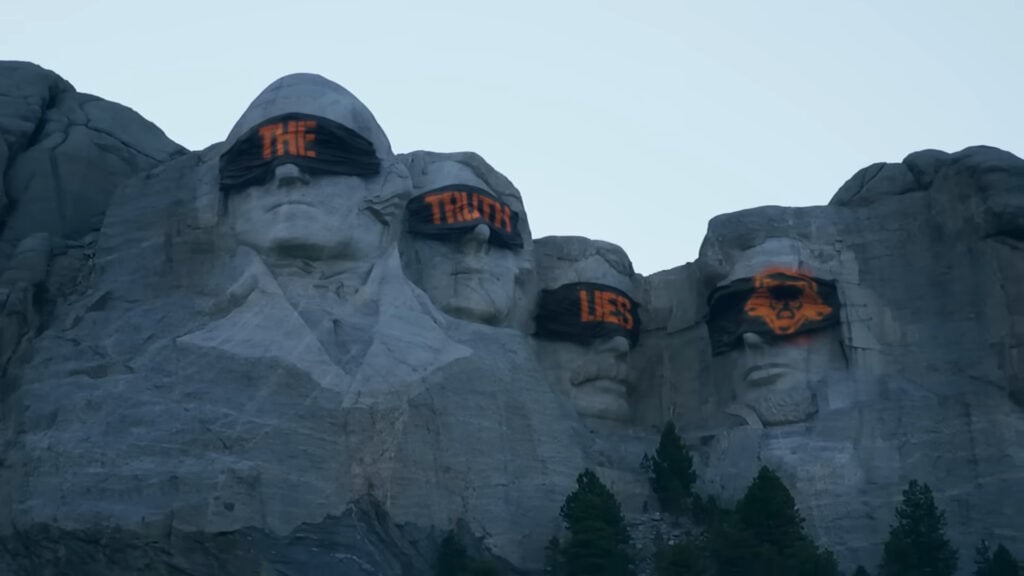 Screenshot from a video released on Call of Duty's YouTube channel as part of the "The Truth Lies" campaign. Shows the faces of Mt. Rushmore with blindfolds on them.