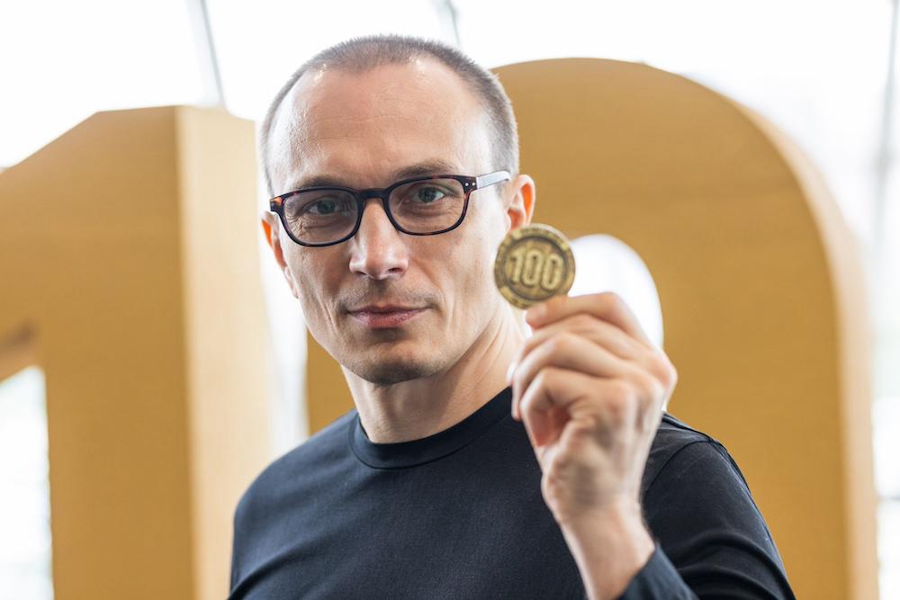 Carmac with a coin that commemorates IEM 