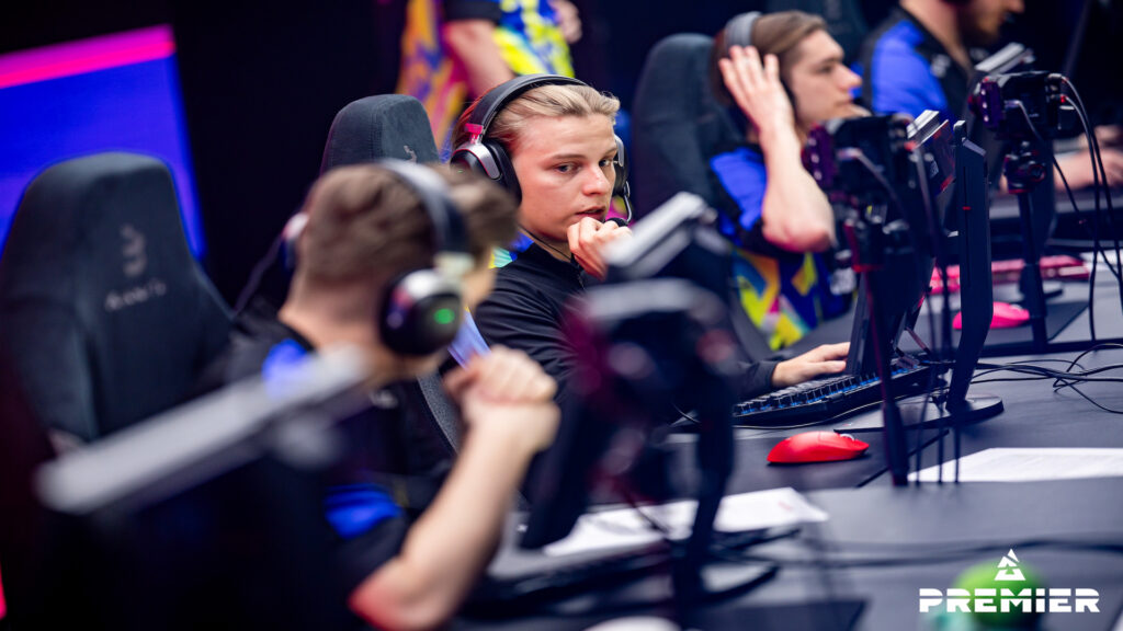 Photo taken of NAVI's CS2 team at the BLAST Premier Spring Final 2024. They were sitting in front of their computers on the stage, playing the game.