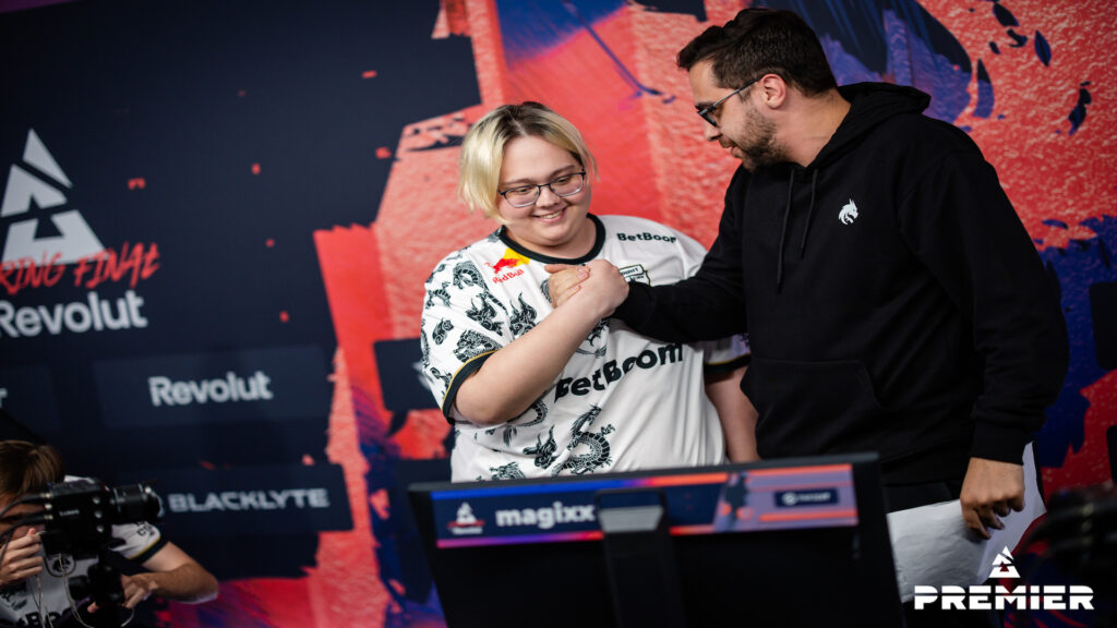 Team Spirit's CS2 members magixx and hally shake hands during the BLAST Premier Spring Final.