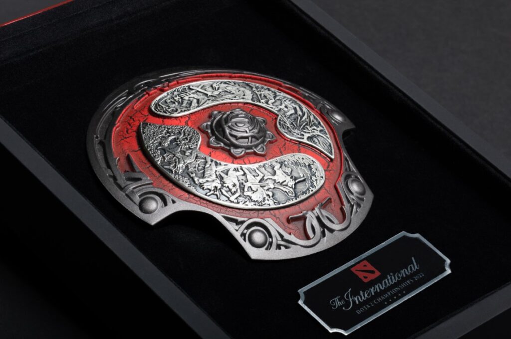TI 2022 Collector's aegis, a red Aegis of Champions miniature replica